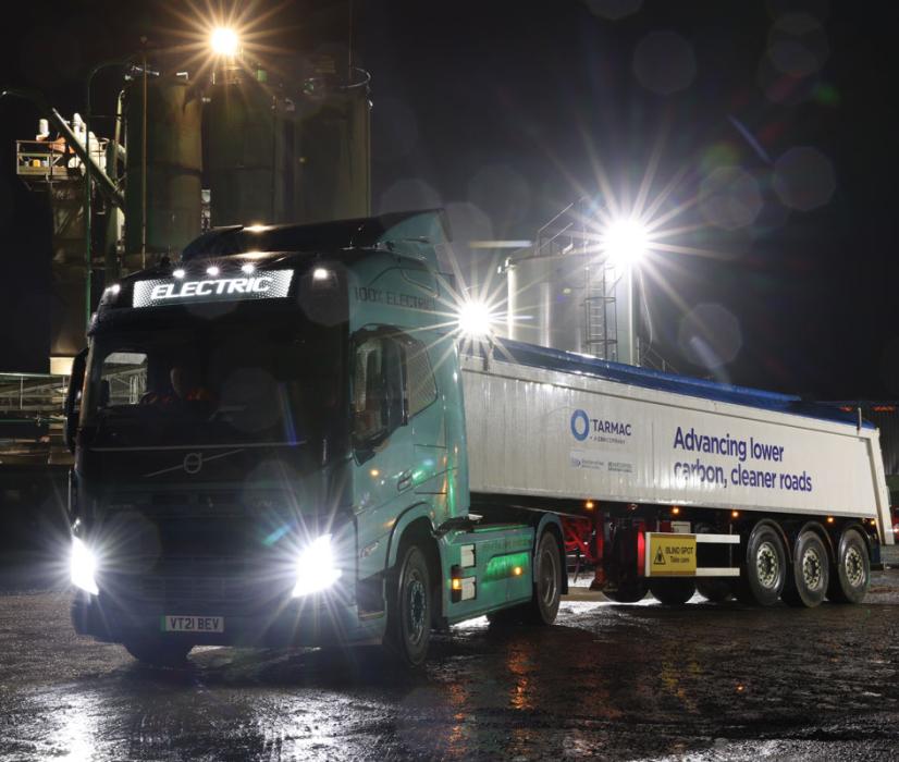 Electric truck delivering asphalt