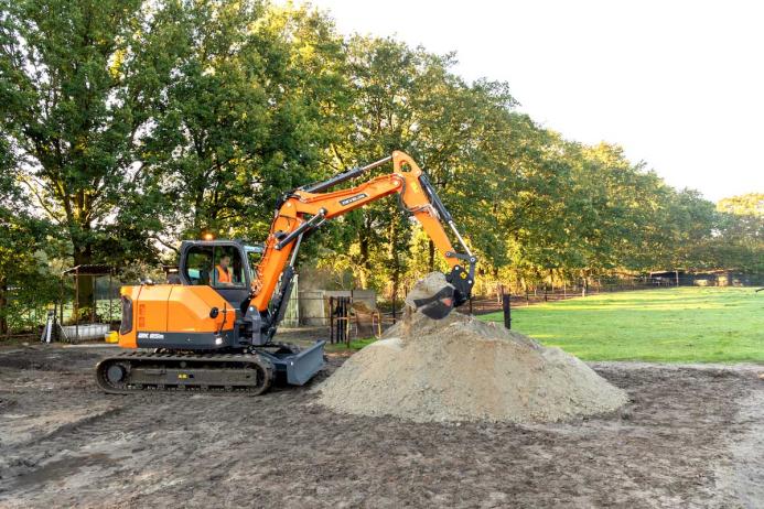Develon DX85R-7 compact excavator in operation 