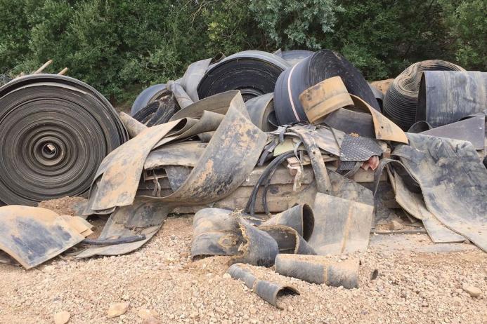 Out with the old – ruined and worn out imported multi-ply belting from the pre-Dunlop days