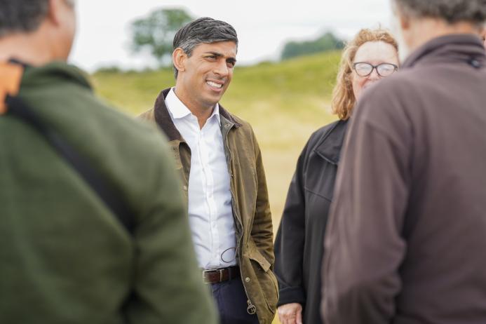 Rishi Sunak talking to staff and volunteers at Thornborough Henges in North Yorkshire. Photo: The Conservative Party