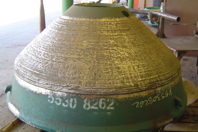 Crusher cone with wearfacing applied