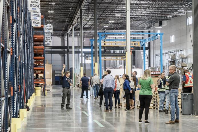 Grand opening attendees tour the new distribution centre