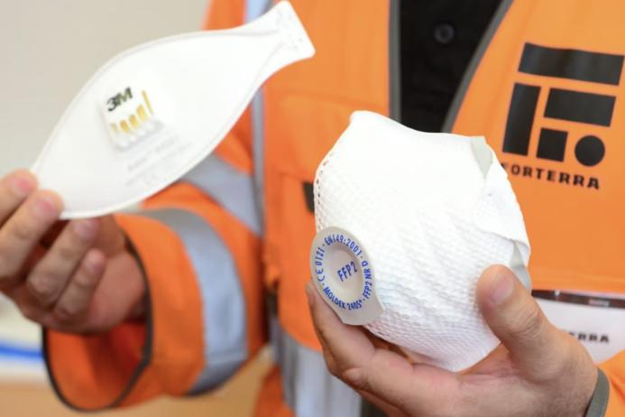 Bins are placed in convenient and visible locations so that workers can use to recycle used gloves and masks
