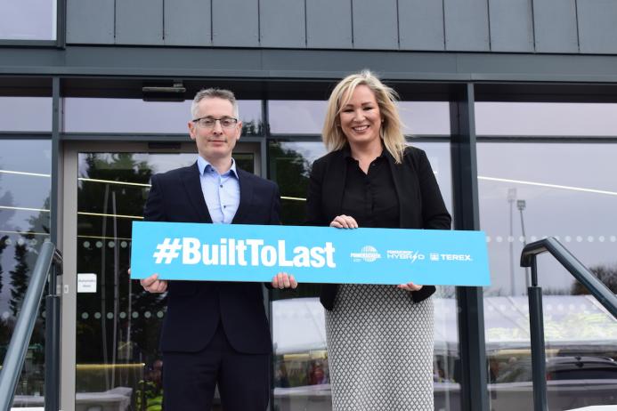 Sean Loughran, Powerscreen business line director and general manager of Terex Dungannon, with First Minister Michelle O’Neill MLA at the official ribbon-cutting ceremony of Powerscreen’s new headquarters 