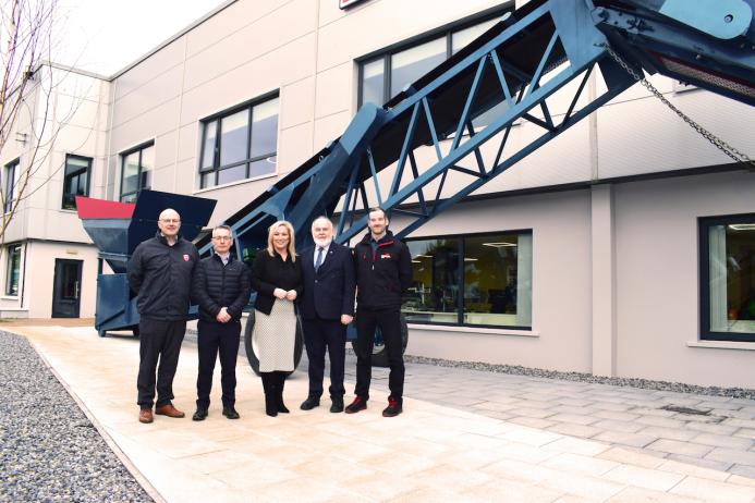 L-R: Dominic Molloy, Chair of Mid Ulster Council; Sean Loughran, Powerscreen business line director and general manager of Terex Dungannon; First Minister Michelle O’Neill; Francie Molloy, Sinn Fein; and Conor Kennedy, operations director at Terex Dungannon in front of the MK1, one of Powerscreen’s first machines
