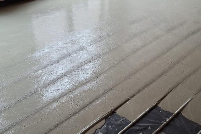 Thin layer of Cemfloor placed over an underfloor heating system