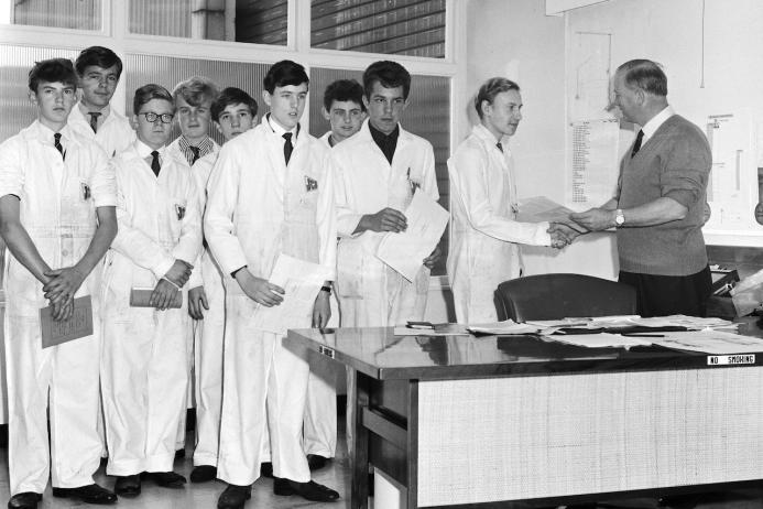 Class of 1964 (L–R): John Smith, Mick Higgs, Nigel Heinich, Geoff Mellor, Keith Hepden, Chris Carnwell, Don Rushton, Johnny Millward, Billy Brighouse, and JCB founder Joseph Cyril Bamford