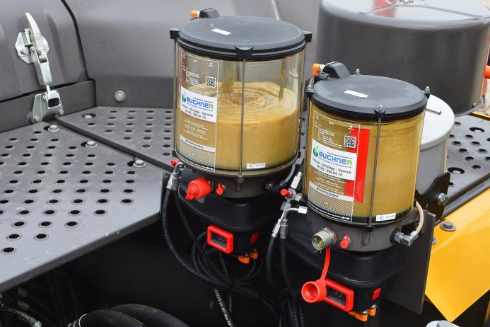 Two central lubrication systems, one of which uses biodegradable lubricant for underwater tasks