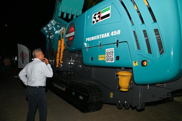 A customer at the Al Marwan event studies Premiertrak 450 jaw crusher
