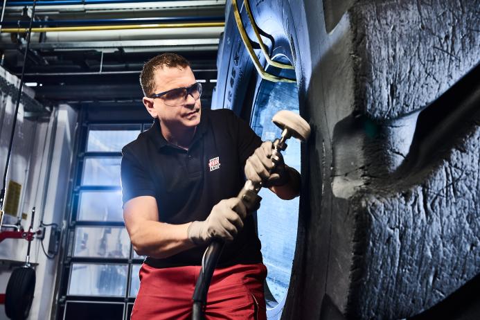 Matthias Ziller, global application and product management - automotive at Rema Tip Top AG, working on an OTR tyre repair