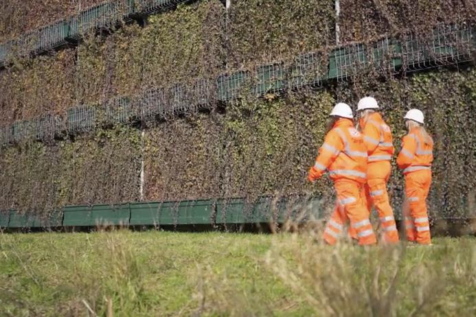 Part of the 18m high green acoustic barrier at Cricklewood