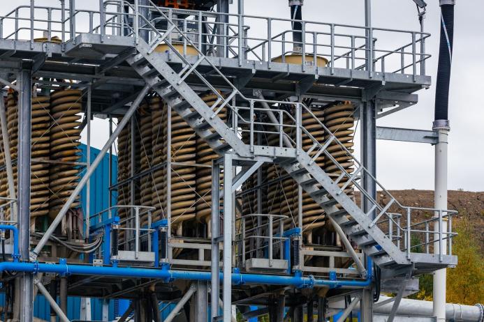 Spiral separators facilitate removal of heavy contaminants from the sand stream