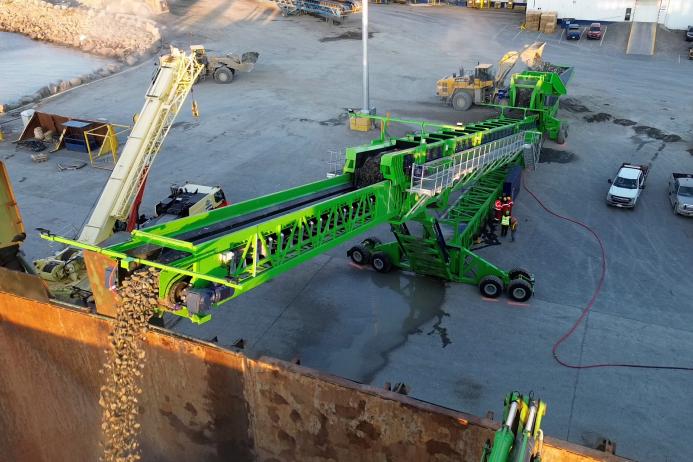 Telestack TB 52 shiploader discharging into a DEME flexible fallpipe vessel
