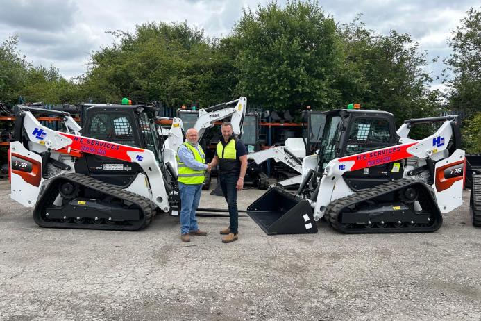 L-R: Malcolm Gough, national hire manager at H.E. Services, and Graham Deacon, national and key accounts sales manager for Doosan Bobcat for the UK and Ireland, with some of the new T76 tracked loaders