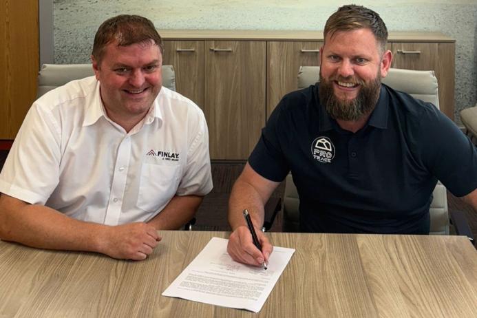 L-R: Finlay general manager and business line director Matt Dickson with Mike Maher, founder and chief executive officer of ProTrack, signing the new dealership agreement