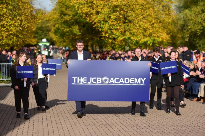 Former JCB Academy students, now JCB employees, march in the cavalcade