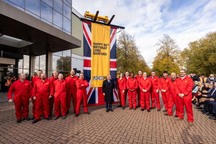 JCB’s demonstration team and Lord Bamford