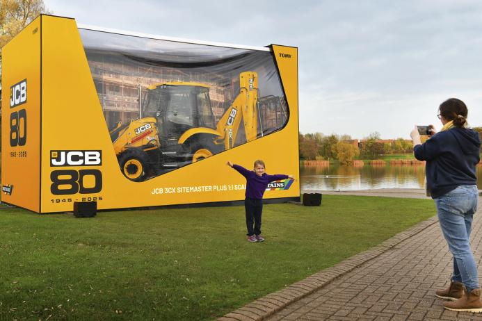 Lexi Edwards, aged six, a pupil of Dove First School in Rocester, Staffs, and mum Isabel marvel at the JCB ‘Backhoe in a Box’ at JCB’s World HQ