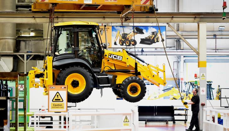 A JCB backhoe comes off the production line 