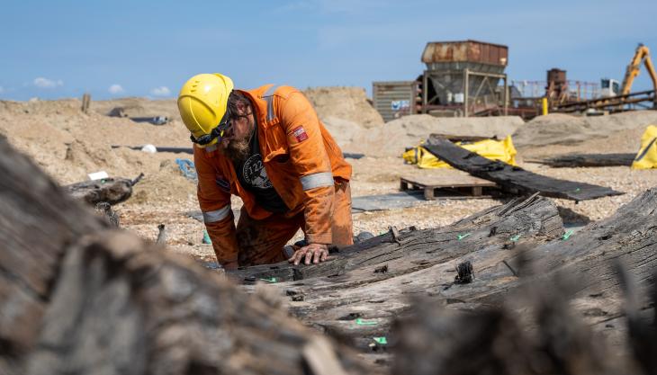 An archaeologist from Wessex Archaeology records the ship’s remains on site. Photo: Wessex Archaeology Wessex Archaeology