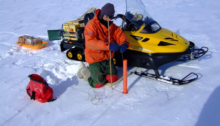 BAS research scientist preparing an explosive charge British Antarctic Survey