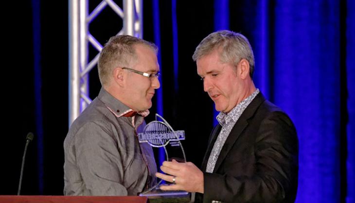 Austin Carey receives the award from Joe Cassidy