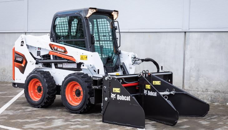 The new Bobcat Soil & Asphalt Spreader attachment Bobcat