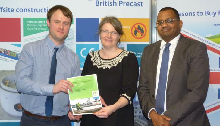 British Precast’s Matt Butcher (left), environmental and technical officer, and Hafiz Elhag (right), sustainability and product association manager, receiving the published hollowcore flooring EPD from Jane Anderson, principal consultant at thinkstep Ltd, during Ecobuild 2017 British Precast