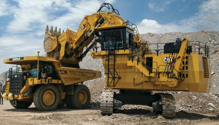 The new Cat 6030 hydraulic shovel loading a Cat 777G dumptruck Cat 6030 hydraulic mining shovel