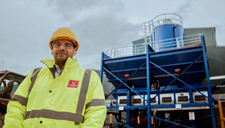 Nick Cowley, operations director of Cubis Industries, in front of the bespoke Rapid concrete batching plant Nick Cowley