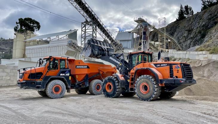 One of Canteras de Santullán's new DL550-5 wheel loaders loading a one of their new DA30-7 ADTs Doosan DL550-5 wheel loader and DA30-7 ADT