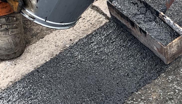 Elastomac rubberized road repair material