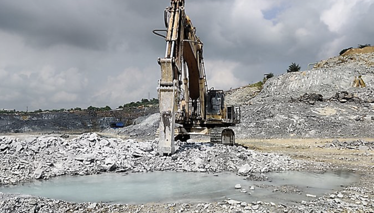 An Epiroc HB 10000 hydraulic breaker being used for primary rock excavation by Birla Cement Epiroc HB 10000 hydraulic breaker