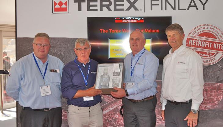 L–R: Nigel Irvine, sales director of Terex Finlay; Charlie Nairn, director of Finlay Northern; Patrick O’Donnell, regional manager UK of Terex Finlay; and John Garrison CEO/president of Terex Corporation Presentation to Charlie Nairn