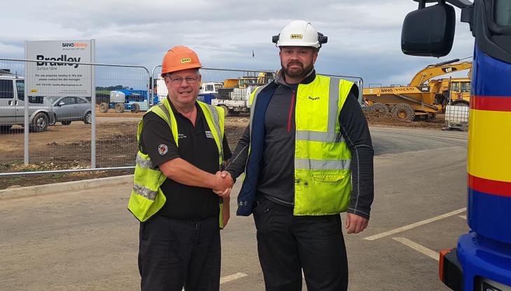 L-R: Bradley site manager Jamie Drysdale and HGV operator Ian Raine First coal from Bradley surface mine