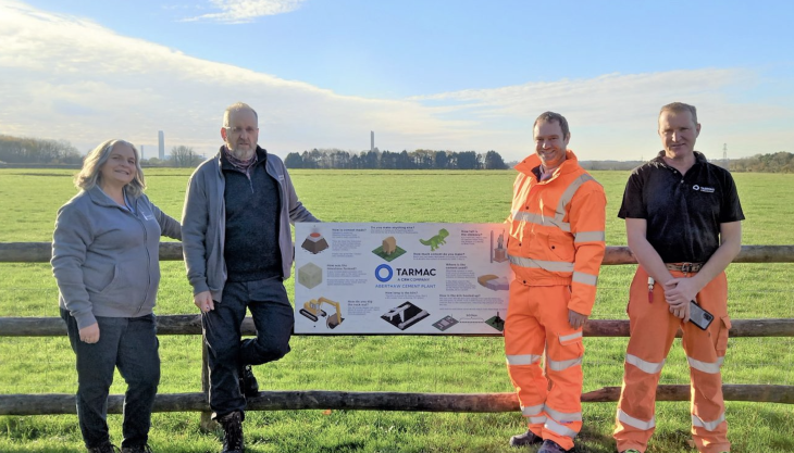 L-R: Fonmon Castle conservation officer Delena Harris, castle owner Nigel Ford, Tarmac’s Aberthaw cement plant environmental co-ordinator, Daniel Bound, and manager Stuart Escott, with the new information board and the cement plant in the background Tarmac Aberthaw