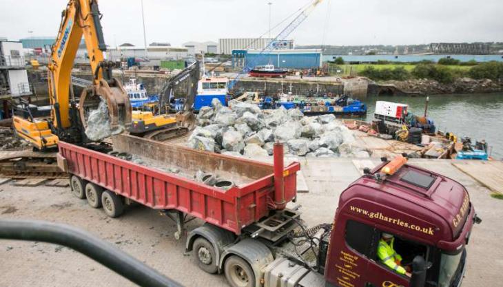 Loading rock armour on to a barge at Pembroke Port Pembroke Port