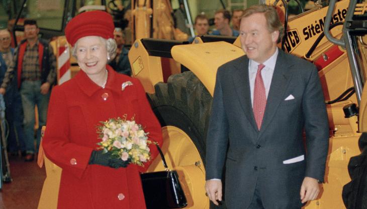 HM Queen Elizabeth pictured with Lord Bamford during her visit to JCB in 1995 JCB