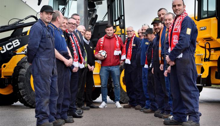 Lincoln City’s Matt Rhead receives a rousing reception from former workmates at JCB Matt Rhead
