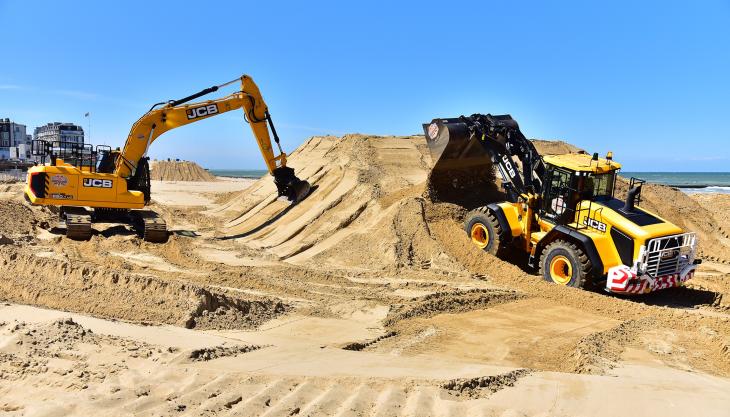 JCB wheel loader and X-Series excavator on the beach at Margate JCB machines on the beach