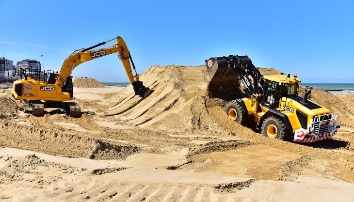 JCB machines on the beach