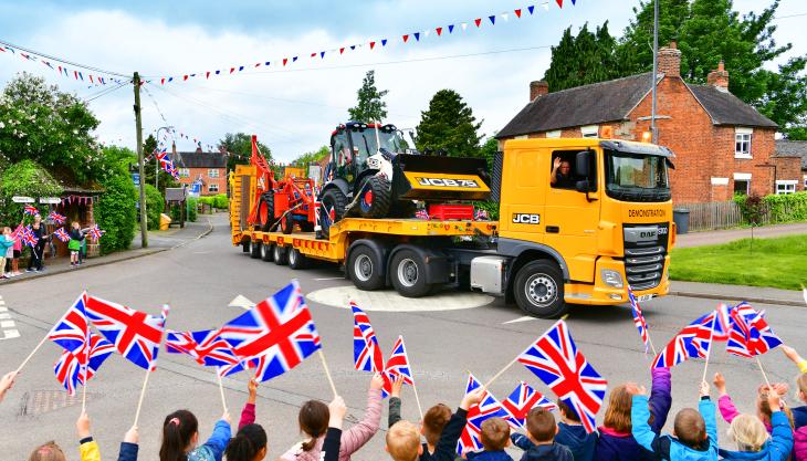 Pupils at All Saints CE Academy in Denstone, Staffordshire, near to JCB’s World HQ in Rocester, give the backhoe loaders a rousing send-off JCB