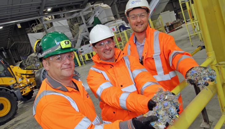 Inside the new Specialised Fuel production plant at Tarmac’s Tunstead cement works (L-R): Dave Lea, site manager; Andrea Magro, head of industrial, Tarmac cement; and David Wilson, Sapphire commercial manager – with handfuls of the new fuel Specialised Fuel plant at Tunstead