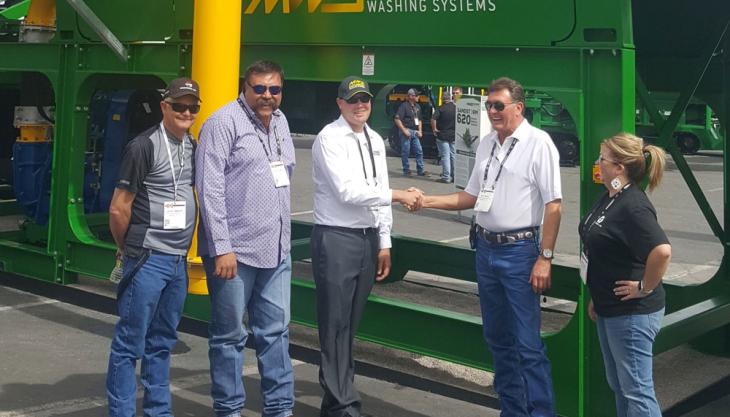 Excel Machinery and McCloskey Washing Systems shaking hands on dealership agreement McCloskey Washing Systems appoint new US dealer