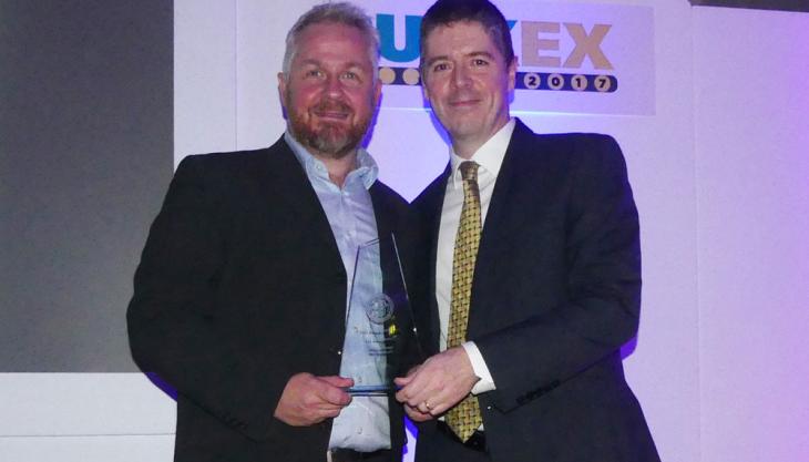 Philip Trimble (left) receives MHEA Innovation Award