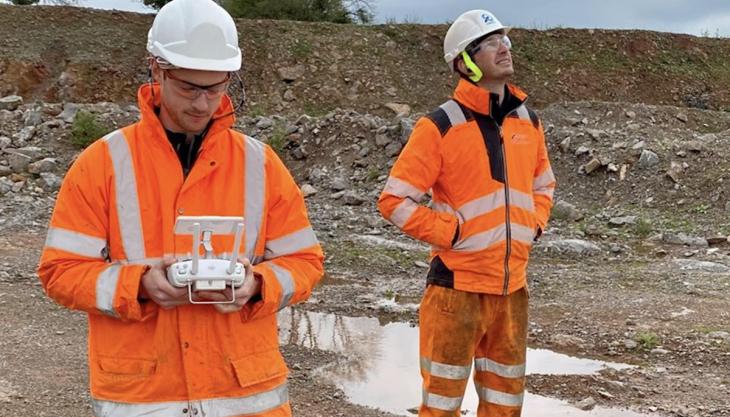 Orica team members flying the latest drone and using RTK equipment Orica flying a drone