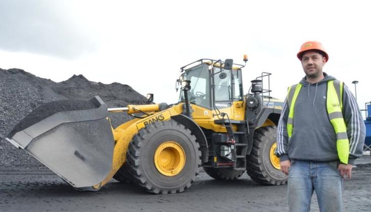 A member of the Shotton team with one of the new Komatsu loading shovels New Komatsu loader