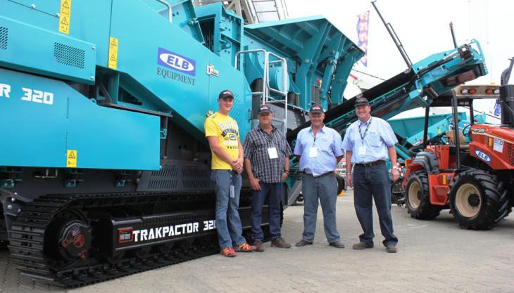 Hein Senekal, Heath Dickson and Craig Sheppard in front of a Trackpactor 320 Powerscreen at Bauma Africa 2013