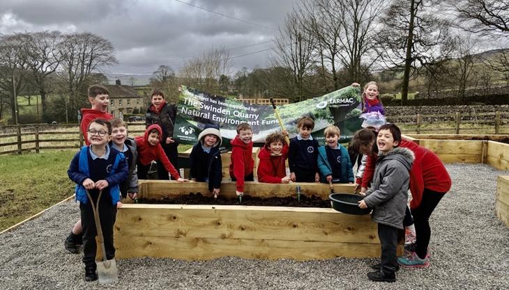 Pupils celebrating their success in the days before the school shut in response to the coronavirus emergency Swinden Quarry Natural Environment Fund