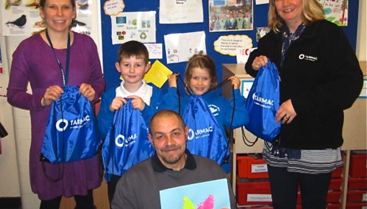 L–R: Kelly Ryan, deputy head teacher; two Sycamore Class pupils; Niki Heath, Tarmac Barnstone’s HR/customer service and finance administrator; with Carl Heath, site manager at the school, in the foreground Robert Miles School